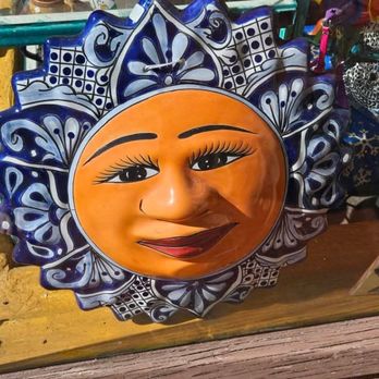 La Iguana Art Gallery - This beautiful sun has sat in their front door/window display for over a year now.  They are never open when the are supposed to be. - Art Galleries Near Me - Tucson, Arizona