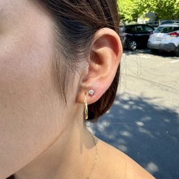 one of two piercings one of two piercings