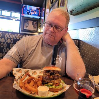 Bad Daddy's Burger Bar - Looking at that stellar burger like how do I fit this in my mouth? (don't worry he found a way to eat it all, and he loved every bite!) - Burgers Near Me - Madison, Alabama Bad Daddy's Burger Bar - Looking at that stellar burger like how do I fit this in my mouth? (don't worry he found a way to eat it all, and he loved every bite!) - Burgers Near Me - Madison, Alabama
