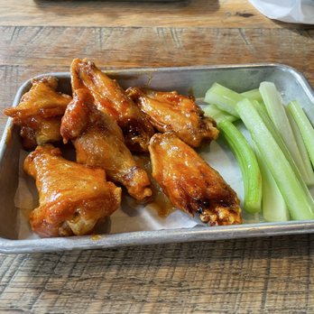 Saucy Brew Works - Honey Sriracha Wings with celery. - Pizza Near Me - Cleveland, Ohio Saucy Brew Works - Honey Sriracha Wings with celery. - Pizza Near Me - Cleveland, Ohio