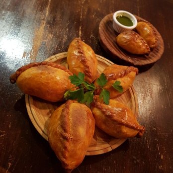 La Paceña Grill Tapas Bar - Salteñas: savory pastries filled with beef, pork or chicken mixed in a sweet, slightly spicy sauce containing olives, raisins and potatoes. - Latin American Near Me - London, XGL