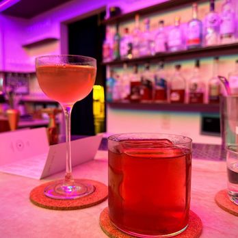 In Plain Sight - two glasses of alcohol on a bar counter - Cocktail Bars Near Me - Austin, Texas