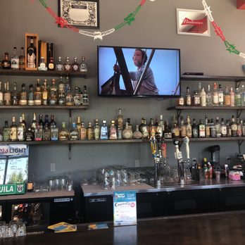 Taco Boy - a bar with liquor bottles on shelves - Mexican Near Me - Durango, Colorado Taco Boy - a bar with liquor bottles on shelves - Mexican Near Me - Durango, Colorado