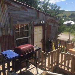 Medicine Park Rentals - Uncle Jed's Tool Shed is a themed rustic cabin that adds to a unique adventure.
