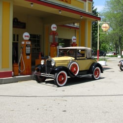 Model A Ford Foundation Museum - 1930 Model A Cabriolet at the replica Shell station nearby.