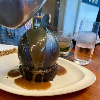 Aurora At The Celeste - The Supernova BEFORE (as caramel is poured over the chocolate outer shell)... - American Near Me - Orlando, Florida