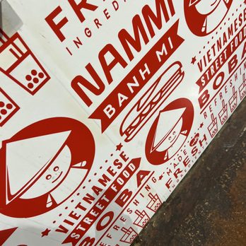 Nammi - a red and white sign on a sidewalk - Vietnamese Near Me - Dallas, Texas Nammi - a red and white sign on a sidewalk - Vietnamese Near Me - Dallas, Texas