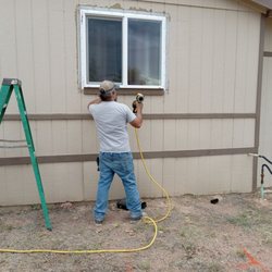 Nu Horizon Renovation - Hanging trim around the new windows we just replaced