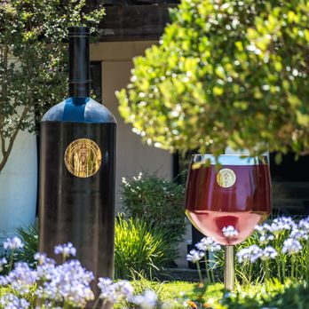 Lightpost Winery - a red wine glass in front of a wine barrel - Wine Tasting Room Near Me - Morgan Hill, California