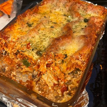 Back 2 The Cutting Board - a casserole dish with meat and cheese - Personal Chefs Near Me