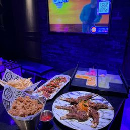 We ordered popcorn chicken , fries , fruits , squid and lamb chop.