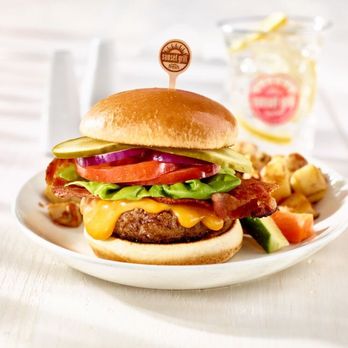 Sunset Grill - 8 oz. juicy burger made fresh with 100% Canadian beef. Served with home fries and veggies & dip. - Diners Near Me - Whitby, Ontario Sunset Grill - 8 oz. juicy burger made fresh with 100% Canadian beef. Served with home fries and veggies & dip. - Diners Near Me - Whitby, Ontario