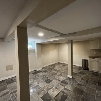 SingleTrack Construction - Remodeling of a mostly unfinished basement. (Note: painting and final trim work not yet done in photo) - General Contractors Near Me
