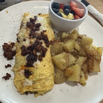 Nonis Brunch House - South of The Border Omelet 3 Eggs, Chorizo, Pico de Gallo, Salsa Roja, Mozzarella Cheese, Hash Browns or Home Fries & One Side - Breakfast & Brunch Near Me - Melissa, Texas