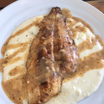 Iguanas - Flounder on grits with Cajun cream sauce. To die. - Seafood Near Me - St. Simons, Georgia