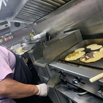 Antojitos De Mi Barrio - The chef and owner cooking to perfection - Food Trucks Near Me - Denver, Colorado