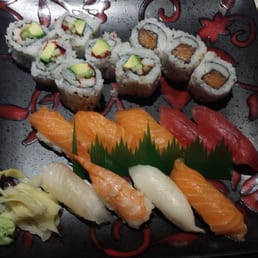 a plate of sushi and chopsticks a plate of sushi and chopsticks