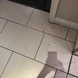 Cracks in tile outside elevator since I began my tenancy, over 15 months ago.