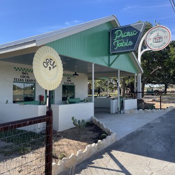 Pontotoc Vineyard Picnic Table - he outside of the restaurant - Wine Tasting Room Near Me - Hye, Texas Pontotoc Vineyard Picnic Table - he outside of the restaurant - Wine Tasting Room Near Me - Hye, Texas