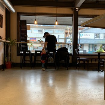 The Ledge Community Coffee House - a man and a child sitting at a table - Coffee & Tea Near Me - Squamish, British Columbia The Ledge Community Coffee House - a man and a child sitting at a table - Coffee & Tea Near Me - Squamish, British Columbia