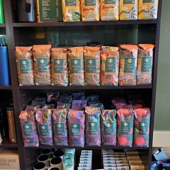 Starbucks - a shelf full of coffee bags and coffee mugs - Coffee & Tea Near Me - St. Louis, Missouri Starbucks - a shelf full of coffee bags and coffee mugs - Coffee & Tea Near Me - St. Louis, Missouri