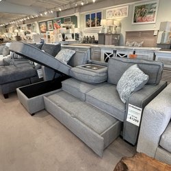 Wholesale Furniture Gallery - This is a neat sofa!! Storage and added sleep space!! The arms come off to accommodate getting into small spaces too!