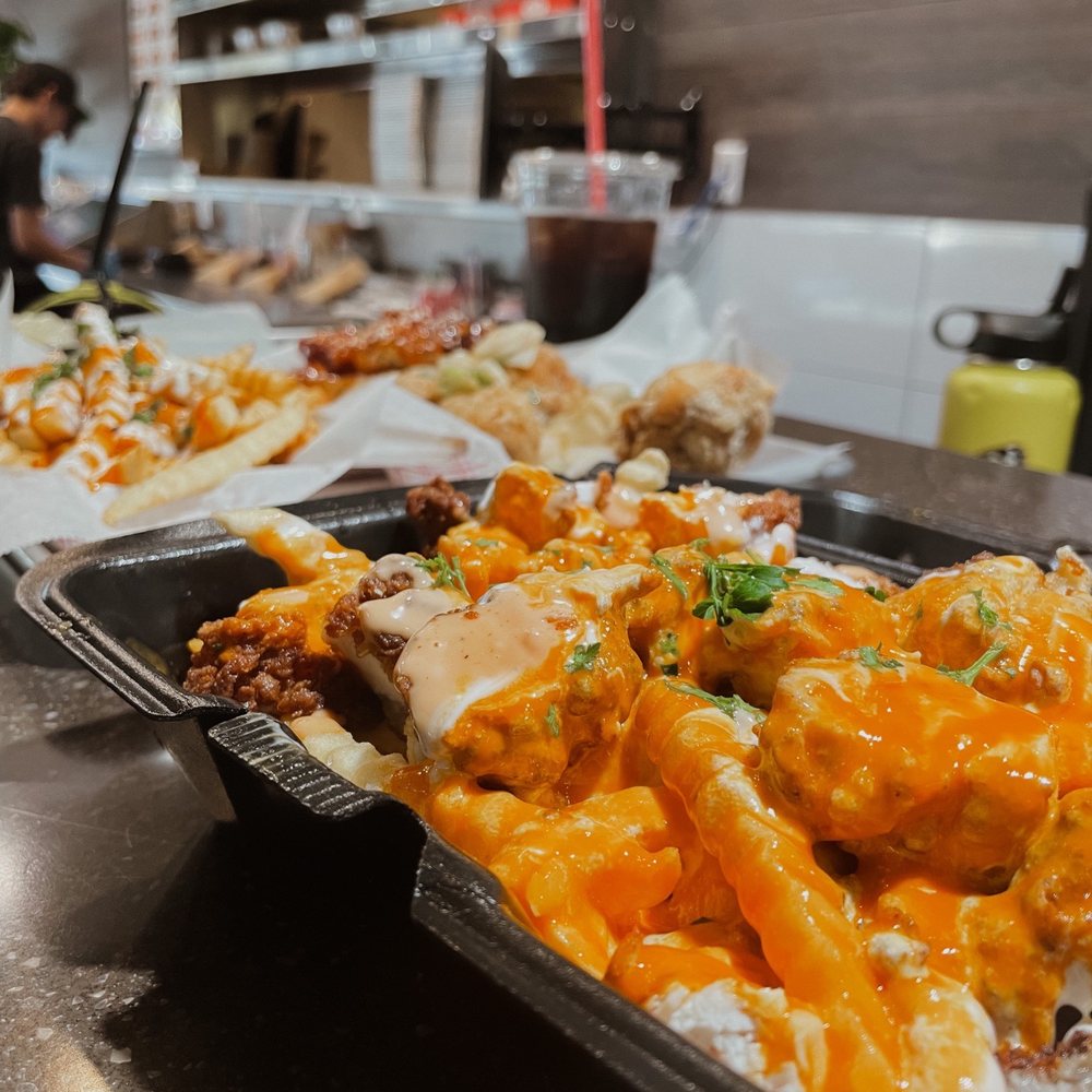 Fire Wings - two trays of food on a counter - Chicken Wings Near Me - Reno, Nevada Fire Wings - two trays of food on a counter - Chicken Wings Near Me - Reno, Nevada