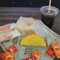 Del Taco - Three snack tacos and a cold beverage.