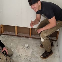 Slakey - Colton , chase setting up a shower curb and shower pan. These guys are the greatest.