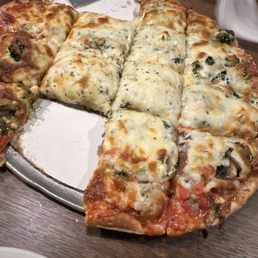 a sliced pizza on a pan