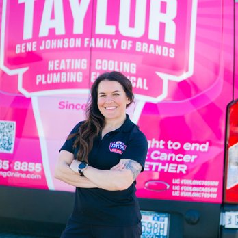 Taylor Heating & Air Conditioning - General Manager Nikki Rizzi, posing with Taylor's iconic pink truck supporting Breast Cancer Awareness! - Heating & Air Conditioning/HVAC Near Me - Puyallup, Washington Taylor Heating & Air Conditioning - General Manager Nikki Rizzi, posing with Taylor's iconic pink truck supporting Breast Cancer Awareness! - Heating & Air Conditioning/HVAC Near Me - Puyallup, Washington