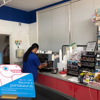 mobil - a woman standing at a counter in a store - Gas Stations Near Me - Marathon, Florida