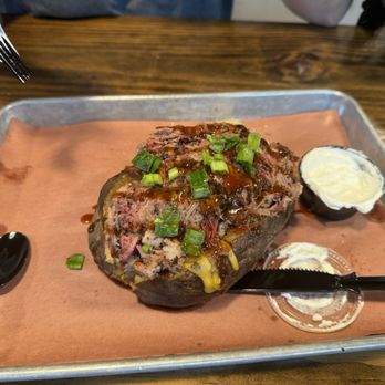Hurtado Barbecue - Loaded Brisket Potato - Barbeque Near Me - Arlington, Texas Hurtado Barbecue - Loaded Brisket Potato - Barbeque Near Me - Arlington, Texas