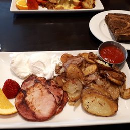 Northshore Breakfast Canadian back bacon, potatoes, poached eggs and rye bread. Northshore Breakfast Canadian back bacon, potatoes, poached eggs and rye bread.