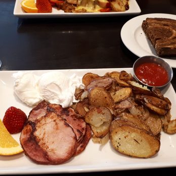 The Lobby Restaurant + Lounge - Northshore Breakfast Canadian back bacon, potatoes, poached eggs and rye bread. - Canadian (New) Near Me - North Vancouver, British Columbia The Lobby Restaurant + Lounge - Northshore Breakfast Canadian back bacon, potatoes, poached eggs and rye bread. - Canadian (New) Near Me - North Vancouver, British Columbia