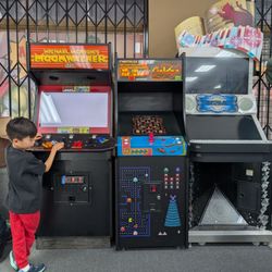 Anastasia’s Collectibles Disney - 3 arcade machines in front