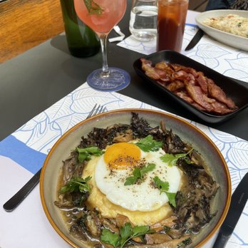 Lindens - Polenta and mushrooms, side of bacon, chrysanthemum spritz and Bloody Mary - New American Near Me - New York, New York