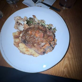 Union Public House - Crispy Pork Shank with mashed potatoes and Brussel sprouts. - New American Near Me - Pensacola, Florida