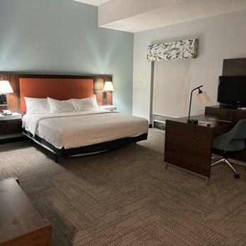 Hampton Inn & Suites Navarre - Desk and bed. - Hotels Near Me - Navarre, Florida