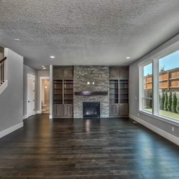Sage Built Homes - a large living room with a stone fireplace - General Contractors Near Me - Beaverton, Oregon Sage Built Homes - a large living room with a stone fireplace - General Contractors Near Me - Beaverton, Oregon