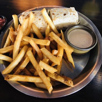 Twilight Tavern - Grilled chicken jerk wrap - Sports Bars Near Me - Nashville, Tennessee Twilight Tavern - Grilled chicken jerk wrap - Sports Bars Near Me - Nashville, Tennessee