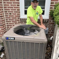 Dzo Mechanical - Chris installing a new split system.