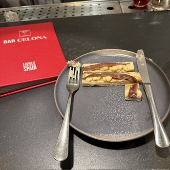 Bar Celona - anchovy toast, eating in progress. - Tapas Bars Near Me - New York, New York