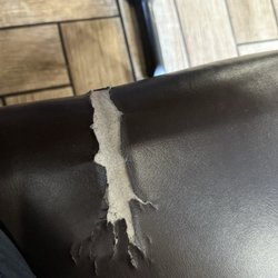 7 Mares - Big rip in booth seating needs to be repaired (or taped up)