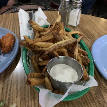 Palm Street Pub & Grill - a plate of fries and a bowl of dip - Sports Bars Near Me - Carmichael, California