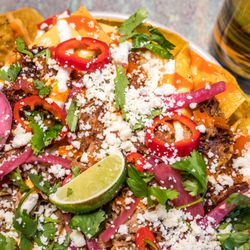 Nine Giant Brewing - Carnitas nachos with habanero salsa and crema
