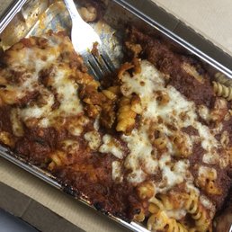 a fork in a pan of pasta