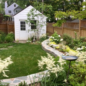 Bethesda Garden Design - DC backyard, curved retaining wall, shed, cedar fence and relaxed plantings. - Landscape Architects or Designers Near Me Bethesda Garden Design - DC backyard, curved retaining wall, shed, cedar fence and relaxed plantings. - Landscape Architects or Designers Near Me