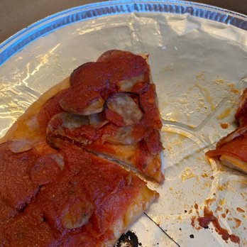 Amici's Pizzeria - a half eaten pizza - Pizza Near Me - North Andover, Massachusetts