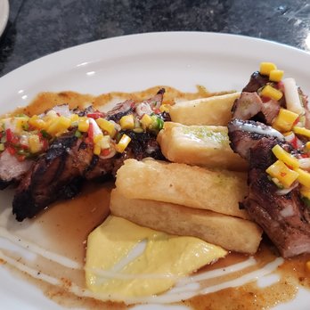 Olla Cafe & Bar - Pork loin with papaya - Latin American Near Me - Stafford, Virginia Olla Cafe & Bar - Pork loin with papaya - Latin American Near Me - Stafford, Virginia